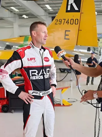 Jarrod Lindemann being interviewed in his custom suit