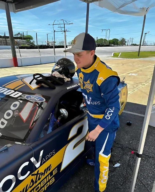Driver wearing a FervoGear custom race suit