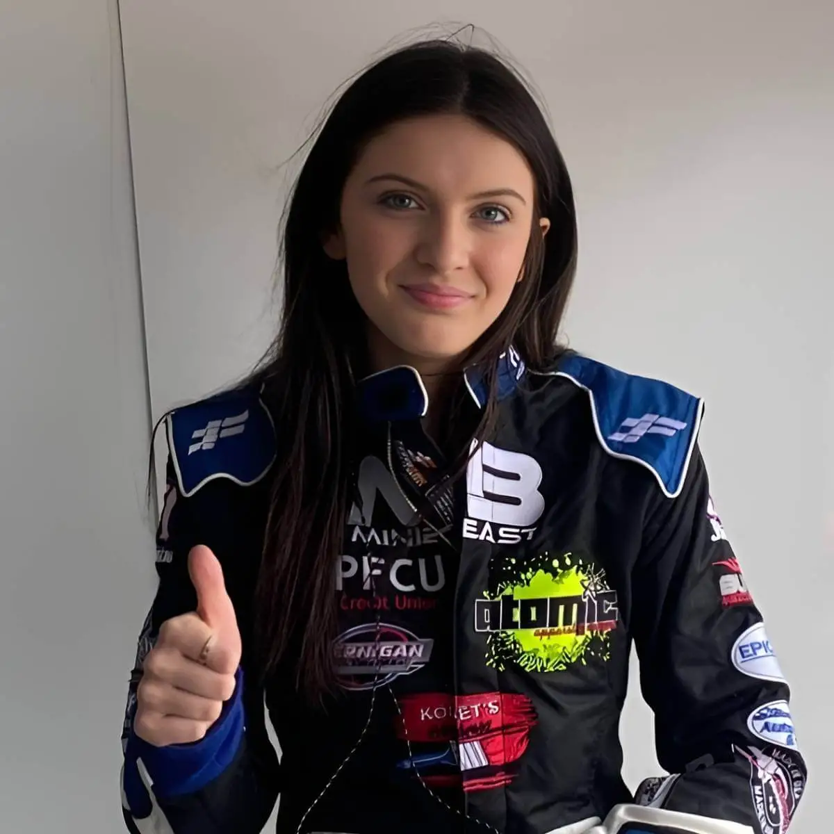 Driver wearing a FervoGear custom race suit