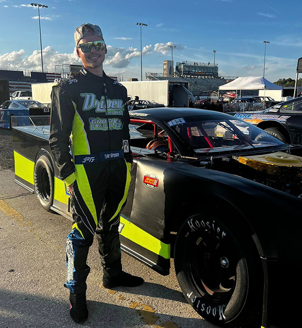 Tyler Simpson wearing a custom FervoGear race suit