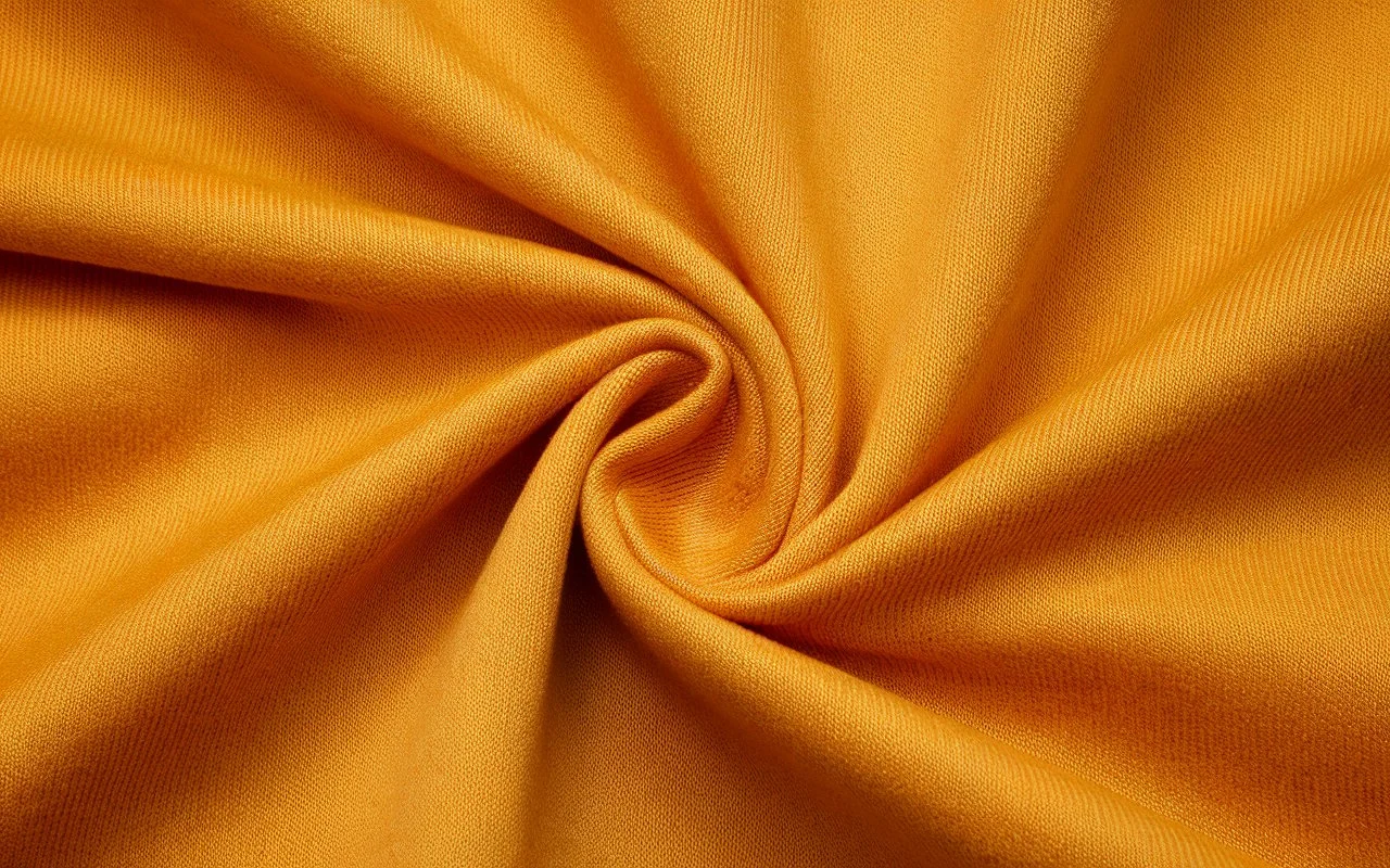 Macro close-up of woven Nomex meta-aramid fabric used to build SFI 3.2A race suits